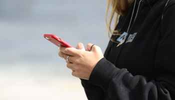 A woman using a mobile phone.