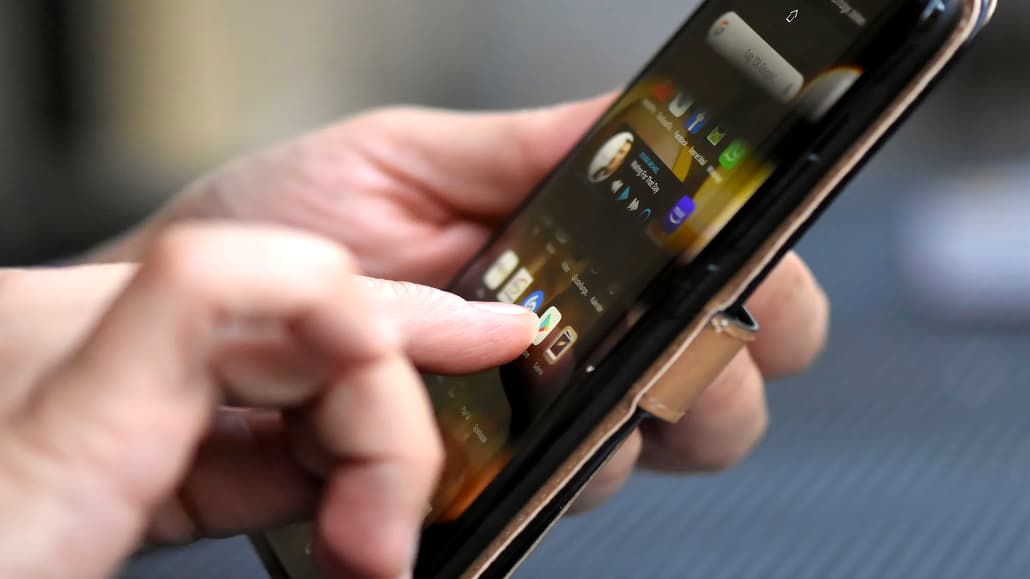 Using an Android phone, tapping the screen with a finger