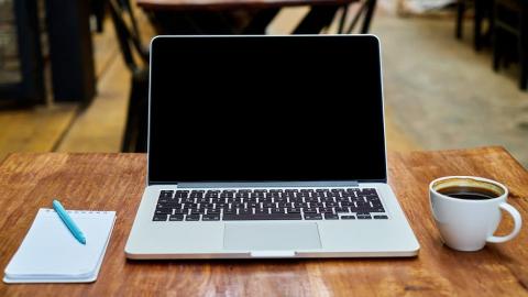 Apple MacBook notepad and coffee: Increase security on your Mac and stay safe on the internet