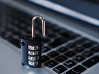 Padlock on a computer keyboard - secure your passwords