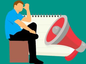 Man sitting and loudspeaker: Have web pages read out loud to you