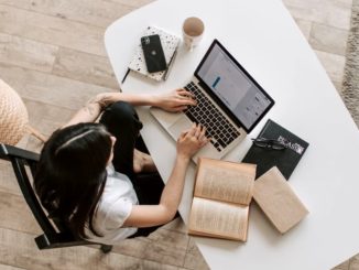 Bird's eye view of a woman using a laptop computer
