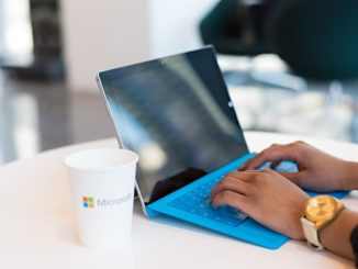 Person typing on laptop computer