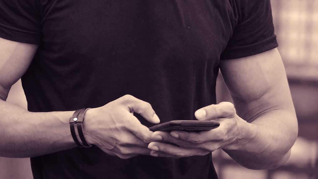 A man using a smartphone.